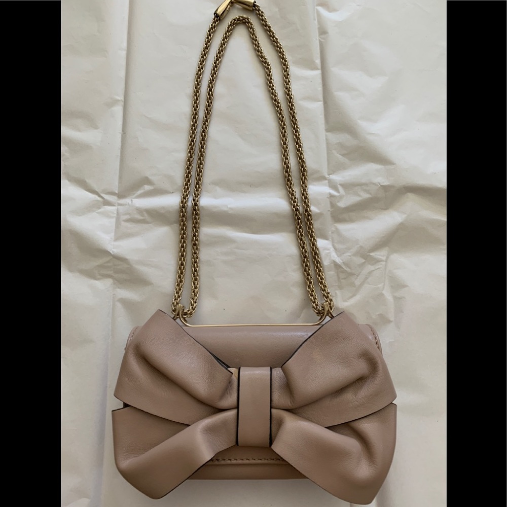 Valentino poudre leather mini bow crossbody bag.
